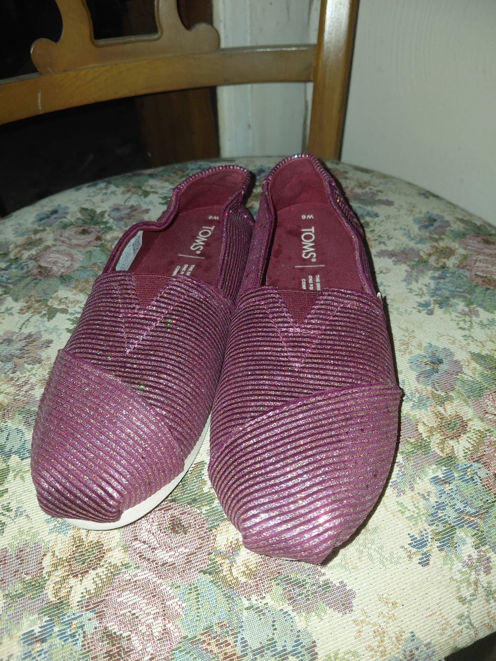 TOMS Alpargatas feature a shimmering cabernet glitter rib knit texture